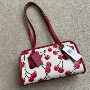 Coach cherry swing zip